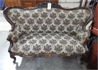 Victorian floral upholstered settee with carved