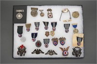 28 Red Cross medals/pins, 1 case.