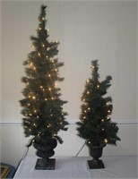 two lighted mini Christmas tree plastic planters