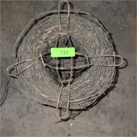 PARTIAL ROLL OF BARBED WIRE