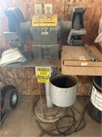 Bench grinder on metal stand