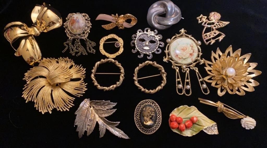 brooches and pins.  one is Sterling silver