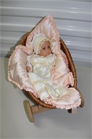 Porcelain Doll in Carriage