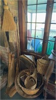 Collection of handmade brooms and baskets, woven