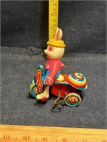 Vintage wind up Rabbit riding bike, made by Suzuki