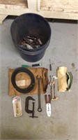 Bucket of miscellaneous tools and a belt
