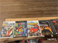 Empty game and movie cases for those movies and