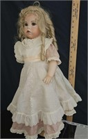 old doll with vintage dress