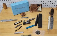 Knives, transistor radio, straight razor, tin
