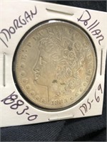 1883-O Morgan Silver dollar with protector