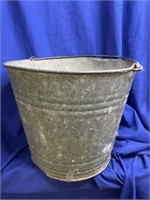 Aluminum Bucket.  Has holes in the bottom