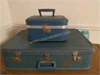 Pair of turquoise blue vintage suitcases