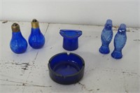 Blue glass shakers and ashtrays