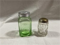 Green pepper shaker and clear salt shaker