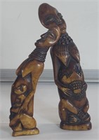 Two composite African figurines 7" x 2" , 6.5" x
