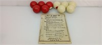 Vintage bumper pool balls and rules sheet