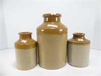 THREE STONEWARE STORAGE JARS