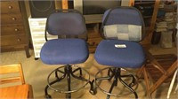 Two blue rolling stools