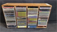 Large Group of Music CDs With Wood CD Shelf