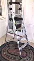 5 foot aluminum step ladder that folds and has a