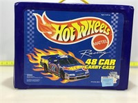 Assorted die cast cars in Hot Wheels carry case