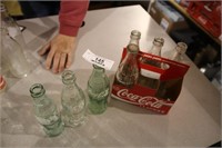 7 VARIOUS COKE BOTTLES