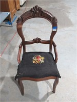 vintage chair with needlework cushion