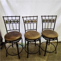 3 swiveling upholstered bar-height chairs