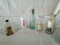 Vintage milk bottles and other bottles