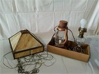 2 electric lamps and a hanging slag glass light