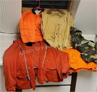 Assorted vintage hunting clothes and army bdus