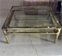 Large brass coffee table with glass top, 1970’s.