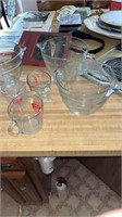 Seven measuring bowls and cups