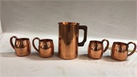 Copper pitcher and 4 mugs