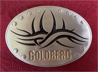 Goldberg belt buckle
