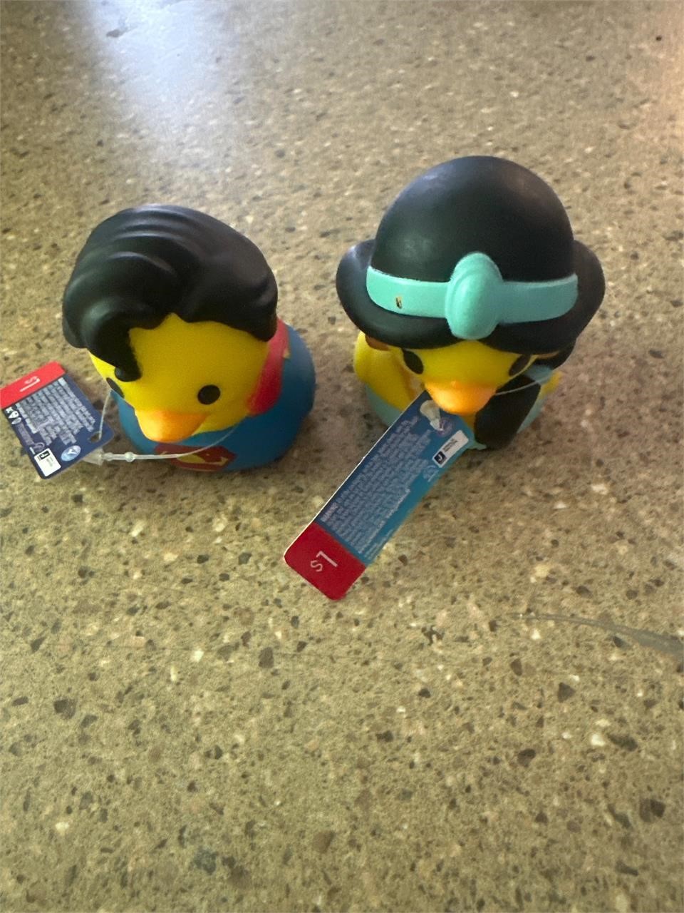 two Disney rubber duckies