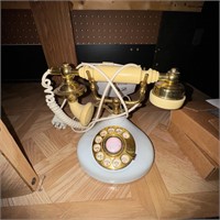 Vintage white with gold color dial telephone.