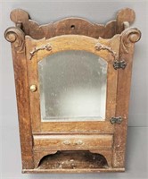 Antique oak wall shaving cabinet with beveled