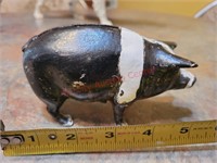 Old metal pig coin bank