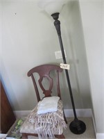 floor lamp, chair, afghan