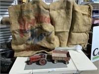 2 burlap sacks, red tractor, red barge box