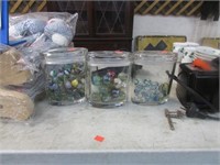 3 SMALL GLASS CONTAINERS OF MARBLES