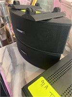 two Bose speakers