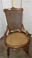 Cane arm rocking chair