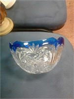 Glass bowl with cobalt trim.