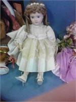 Porcelain doll in beige dress