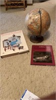 Globe, Norman Rockwell book, and a Storyville