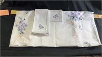 64x100 embroidered tablecloth & 8 embroidered