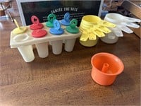 Popsicles molds, Tupperware measuring cups,