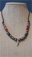 Beaded necklace on 25 in leather strand